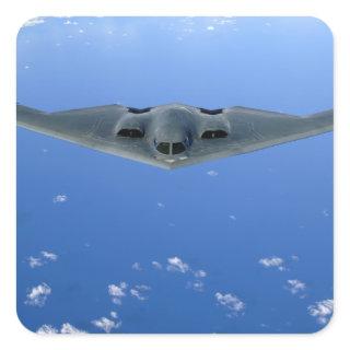 A B-2 Spirit soars through the sky Square Sticker