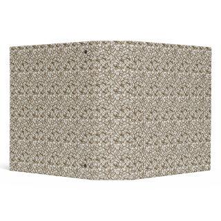 A brown rug with a geometric motif is partially co 3 ring binder