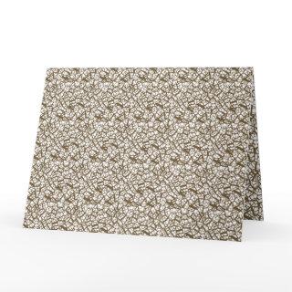 A brown rug with a geometric motif is partially co card