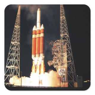 A Delta IV Heavy rocket lifts off Square Sticker