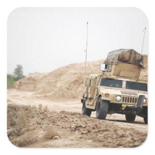 A Humvee conducts security Square Sticker