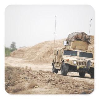 A Humvee conducts security Square Sticker