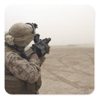 A Marine fires the M-32 Square Sticker