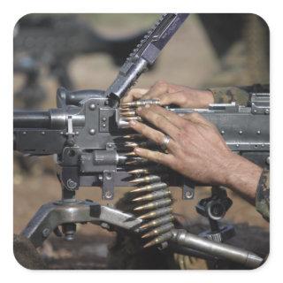 A Marine loads a M-240G machine gun Square Sticker