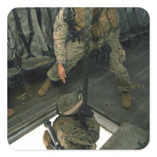 A Marine sends a fellow Marine down the hell ho Square Sticker