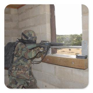 A soldier acts as an opposition force square sticker