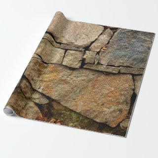 A stone wall made of cobblestones background textu