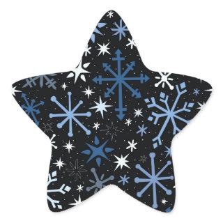 A whimsical flurry of blue snowflakes on black star sticker