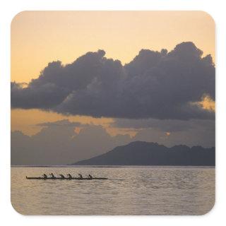 An outrigger canoe team practices off the coast square sticker