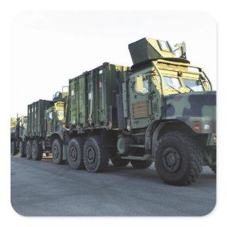 Armored trucks sit on the pier at Morehead City Square Sticker