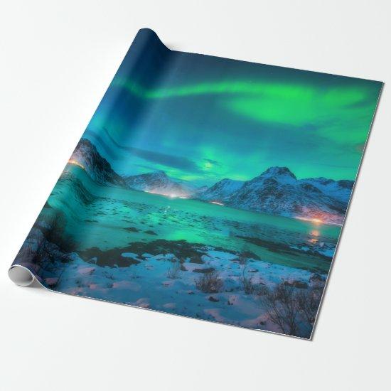 Aurora borealis over the sea coast, snowy mountain