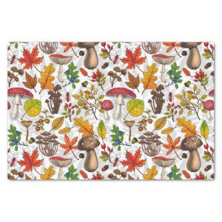 Autumn mushrooms, leaves, nuts and berries on whit tissue paper