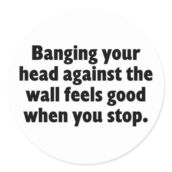 Banging your head against a brick wall classic round sticker