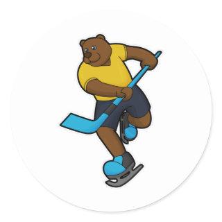 Bear at Ice hockey with Ice hockey stick Classic Round Sticker