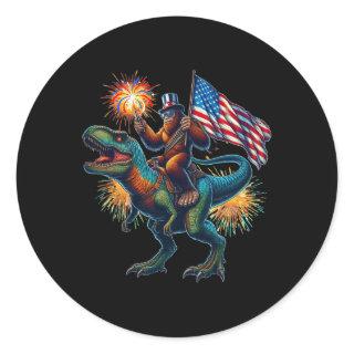Bigfoot Sasquatch Riding Dinosaur T Rex. Funny 4th Classic Round Sticker