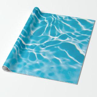 Blue colored clear calm water surface texture with
