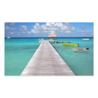 Boats at a jetty in the Pacific rectangle sticker