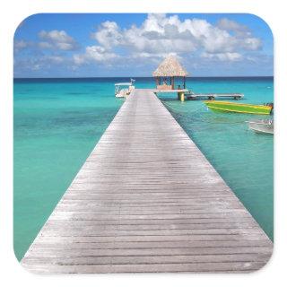 Boats at a jetty in the Pacific sticker