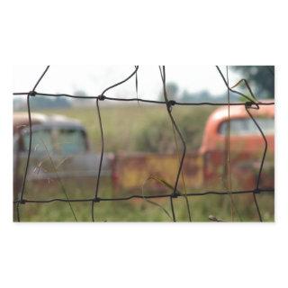 Cars and Trucks Rust Away in a Rural Field Rectangular Sticker