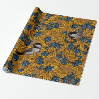 Chickadee birds on blueberry branches