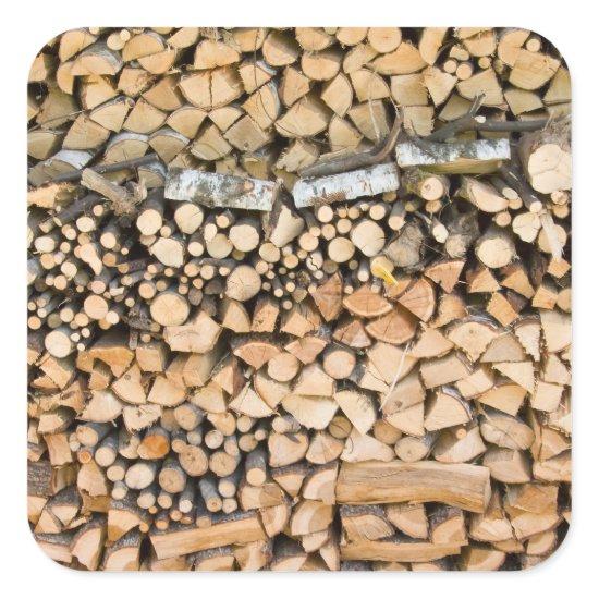 Chopped wood on a pile square sticker