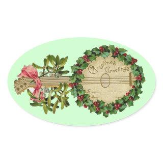 CHRISTMAS BANJO WITH MISTLETOES AND HOLLY BERRIES OVAL STICKER