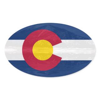 Colorado flag with mountain background oval sticker