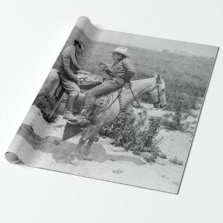 Cowboy and businessman playing checkers on horseba