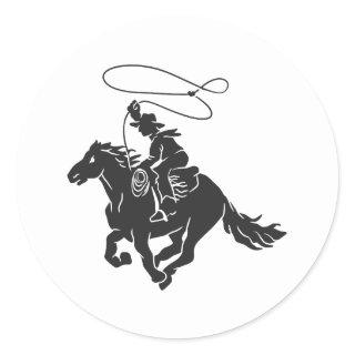 Cowboy on bucking horse running with lasso classic round sticker