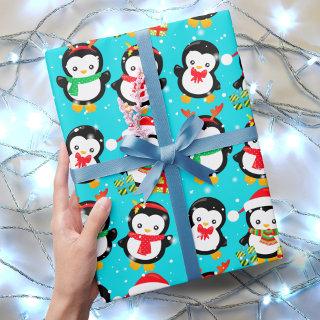 Cute penguins in falling snow winter wonderland