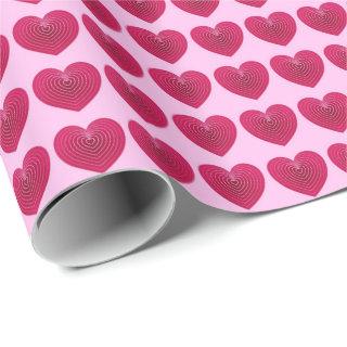 Deep rose red hearts on a pale pink background