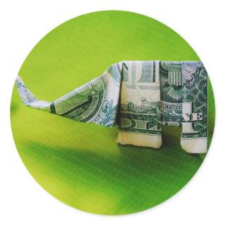 Dollar bill origami Elephant on Green background Classic Round Sticker
