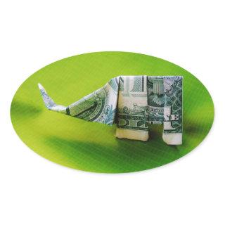 Dollar bill origami Elephant on Green background Oval Sticker