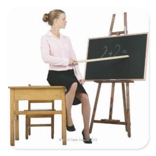 Female Teacher Pointing Ruler at Chalkboard Square Sticker