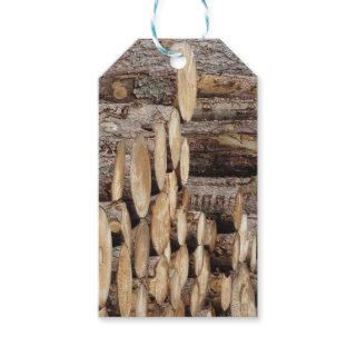 Firewood pile stacked . Woodpile of round logs Gift Tags