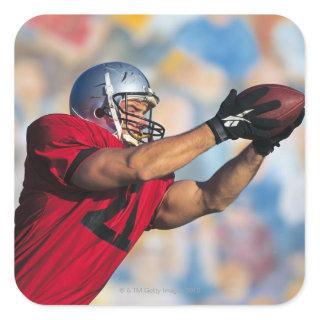 Football receiver catching ball square sticker