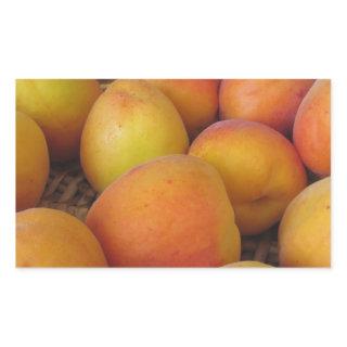 Fresh apricots in a wicker basket rectangular sticker