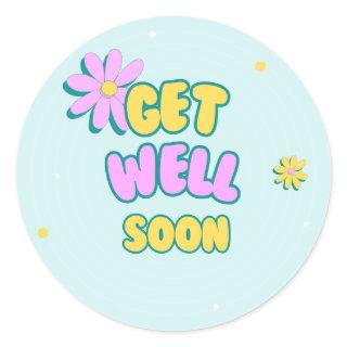 Get well soon bold text with flowers on blue classic round sticker