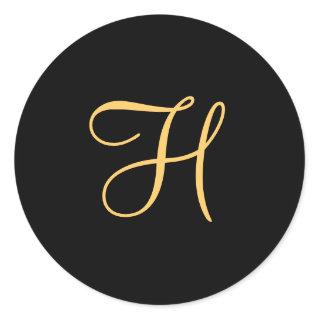 Gold-colored initial H on black monogram  round Cl Classic Round Sticker