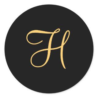 Gold-colored initial H on black monogram  round Cl Classic Round Sticker