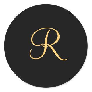 Gold-colored initial R on black monogram  round Classic Round Sticker
