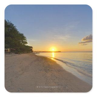 Golden Sun Ball Setting Over Tropical Island Square Sticker