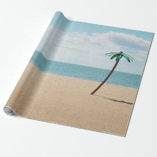 Green artificial palm tree on seashore