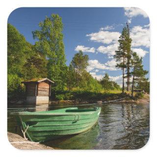Green boat in a fjord in Norway Square Sticker