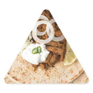 Gyros pita with tzatziki coleslaw olives and feta triangle sticker