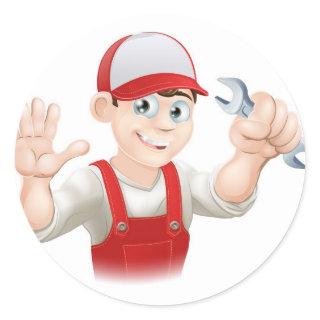 Happy plumber or mechanic with spanner classic round sticker