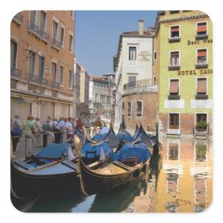 Italy, Venice, gondolas moored along canal Square Sticker