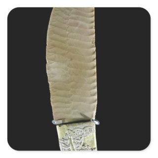 Knife carved with battle scenes square sticker