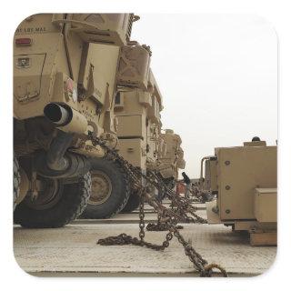 Military vehicles are locked down on semi truck square sticker