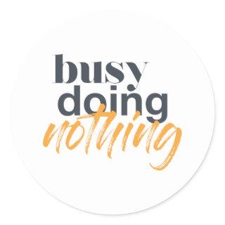 Modern, trendy, urban design of Busy Doing Nothing Classic Round Sticker